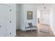 Inviting entryway with wood floors, bench seating, decorative wall art, and open access to other rooms at 4774 E Summerfield Dr, Camby, IN 46113