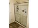 Bathroom with a shower featuring glass doors, a shower head, and modern fixtures at 4871 Franklin Villas Dr, Indianapolis, IN 46237
