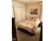 Bright bedroom featuring a decorated queen bed and a double sliding-door closet at 4871 Franklin Villas Dr, Indianapolis, IN 46237
