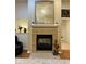 Comfortable living room featuring a fireplace with bright light and pleasing decor at 4871 Franklin Villas Dr, Indianapolis, IN 46237