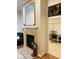 Living room featuring a fireplace and adjacent rooms with plentiful light at 4871 Franklin Villas Dr, Indianapolis, IN 46237
