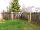 A cozy backyard with grass area enclosed by a wooden fence, offering privacy and space at 4959 Clarkson Dr, Indianapolis, IN 46254