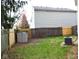 Backyard with a storage shed, AC unit, and a mix of wood and vinyl fencing at 4959 Clarkson Dr, Indianapolis, IN 46254