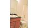 Bathroom featuring tile floors, wood vanity, and tub with shower at 4959 Clarkson Dr, Indianapolis, IN 46254
