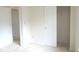 Bedroom featuring neutral walls, carpet flooring, and a closet with sliding doors at 4959 Clarkson Dr, Indianapolis, IN 46254