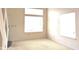Sun-filled bedroom with large windows, neutral carpet, and plenty of natural light enhancing the comfortable space at 4959 Clarkson Dr, Indianapolis, IN 46254