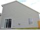 Home featuring vinyl siding, sliding glass doors, and an air conditioning unit at 4959 Clarkson Dr, Indianapolis, IN 46254