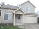 Charming two-story home featuring a two-car garage and welcoming entryway with ample natural light at 4959 Clarkson Dr, Indianapolis, IN 46254