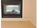 A decorative fireplace with a glass screen at 4959 Clarkson Dr, Indianapolis, IN 46254