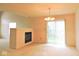 Cozy living area with fireplace and slider to patio at 4959 Clarkson Dr, Indianapolis, IN 46254