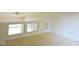Neutral loft area with carpeted floors and a ceiling fan provides additional living space at 4959 Clarkson Dr, Indianapolis, IN 46254