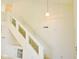 A carpeted staircase with a white railing at 4959 Clarkson Dr, Indianapolis, IN 46254