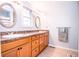 Bathroom with double sink vanity offering plentiful counter space and natural light at 504 W Dwain, Shelbyville, IN 46176
