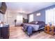Cozy bedroom features wood floors, modern color palette and comfortable furnishings at 504 W Dwain, Shelbyville, IN 46176