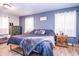 Comfortable bedroom features a bed, dresser, and side table with a cozy feel at 504 W Dwain, Shelbyville, IN 46176