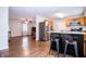Open kitchen with stainless steel appliances, breakfast bar, and seamless flow into the living area at 504 W Dwain, Shelbyville, IN 46176