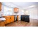 Well-lit kitchen with a window over the sink and a black island with drawers and cabinet storage at 504 W Dwain, Shelbyville, IN 46176