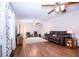 Spacious living room with hardwood floors, a ceiling fan, and ample natural light at 504 W Dwain, Shelbyville, IN 46176