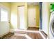 Mud room featuring multiple doorways and a laundry area, combining practicality with household convenience at 504 W Dwain, Shelbyville, IN 46176