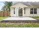 Backyard with concrete patio, siding and sliding glass door at 5105 Hawks Crescent Ct, Indianapolis, IN 46254