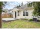 Landscaped backyard featuring a patio and manicured garden beds at 5105 Hawks Crescent Ct, Indianapolis, IN 46254