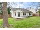 Rear exterior view of the home with a patio and well-kept lawn at 5105 Hawks Crescent Ct, Indianapolis, IN 46254