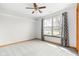 Light-filled bedroom with neutral walls, carpet, and large windows at 5105 Hawks Crescent Ct, Indianapolis, IN 46254