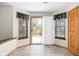 Dining area with access to backyard features bright windows and tile flooring at 5105 Hawks Crescent Ct, Indianapolis, IN 46254