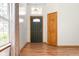 Bright foyer with wood floors, an elegant front door, and sidelight, offering a warm welcome at 5105 Hawks Crescent Ct, Indianapolis, IN 46254