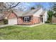 Charming brick and siding home with a well-manicured lawn, attached garage, and welcoming front entrance at 5105 Hawks Crescent Ct, Indianapolis, IN 46254