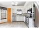 Bright kitchen features white cabinets, stainless steel appliances, and stylish backsplash at 5105 Hawks Crescent Ct, Indianapolis, IN 46254