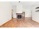 Spacious living room with laminate flooring, fireplace, neutral wall color, and bright lighting at 5105 Hawks Crescent Ct, Indianapolis, IN 46254