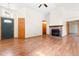 Open living room features laminate floors, fireplace, ceiling fan, and ample natural light at 5105 Hawks Crescent Ct, Indianapolis, IN 46254