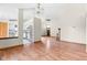 Spacious living room boasts hardwood floors, a brick fireplace, and an open view into the kitchen at 5105 Hawks Crescent Ct, Indianapolis, IN 46254