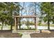 Scenic water feature with flowers in a beautiful community setting at 5105 Hawks Crescent Ct, Indianapolis, IN 46254