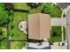 Aerial view of backyard with a round patio, lawn, and fence at 518 Carthage Cir, Westfield, IN 46074