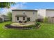 Spacious backyard featuring a patio area and well-maintained lawn, perfect for outdoor living and entertaining at 518 Carthage Cir, Westfield, IN 46074