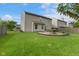 Lush backyard with a patio and well-manicured lawn, ideal for outdoor activities and relaxation at 518 Carthage Cir, Westfield, IN 46074
