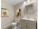 Bathroom featuring a vanity with sink and mirror, a toilet, and decor at 518 Carthage Cir, Westfield, IN 46074
