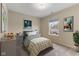 Cozy bedroom features a single bed, window, and neutral tones creating a peaceful ambiance at 518 Carthage Cir, Westfield, IN 46074