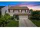 Charming two-story home featuring a two-car garage and a well-manicured lawn at 518 Carthage Cir, Westfield, IN 46074