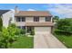 Charming two-story home with a two car garage and manicured lawn at 518 Carthage Cir, Westfield, IN 46074