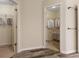 Hallway with wood-look flooring that provides access to a walk-in closet at 518 Carthage Cir, Westfield, IN 46074