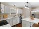 Bright kitchen with stainless steel appliances, quartz countertops, and a view of the backyard at 518 Carthage Cir, Westfield, IN 46074