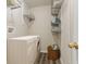 Well-lit laundry room with washer, dryer, and storage shelves above, plus wood-look floors at 518 Carthage Cir, Westfield, IN 46074