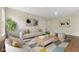 Cozy living room with modern furniture, a neutral sofa, and natural light at 518 Carthage Cir, Westfield, IN 46074