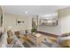 A spacious living room featuring a geometric rug, sofa, and a view into the kitchen at 518 Carthage Cir, Westfield, IN 46074