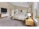 Tranquil primary bedroom with high ceilings, carpet, and modern decor at 518 Carthage Cir, Westfield, IN 46074