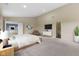 Spacious primary bedroom featuring ensuite access, carpet, and decor at 518 Carthage Cir, Westfield, IN 46074