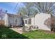Spacious backyard with a patio area ideal for outdoor entertaining and relaxation on a sunny day at 5277 Kingsley Dr, Indianapolis, IN 46220